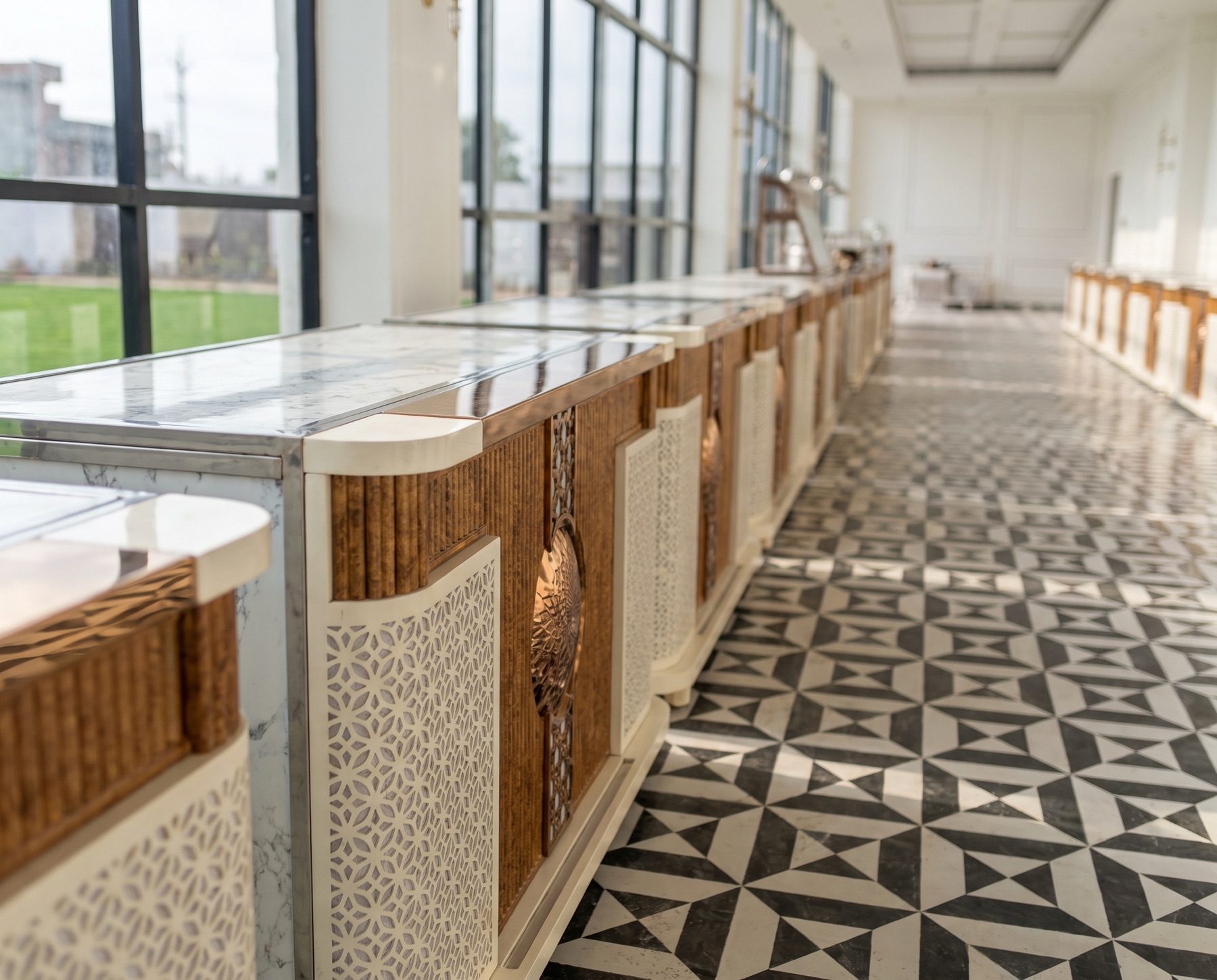 Marble-topped buffet counters with copper and jaali detailing