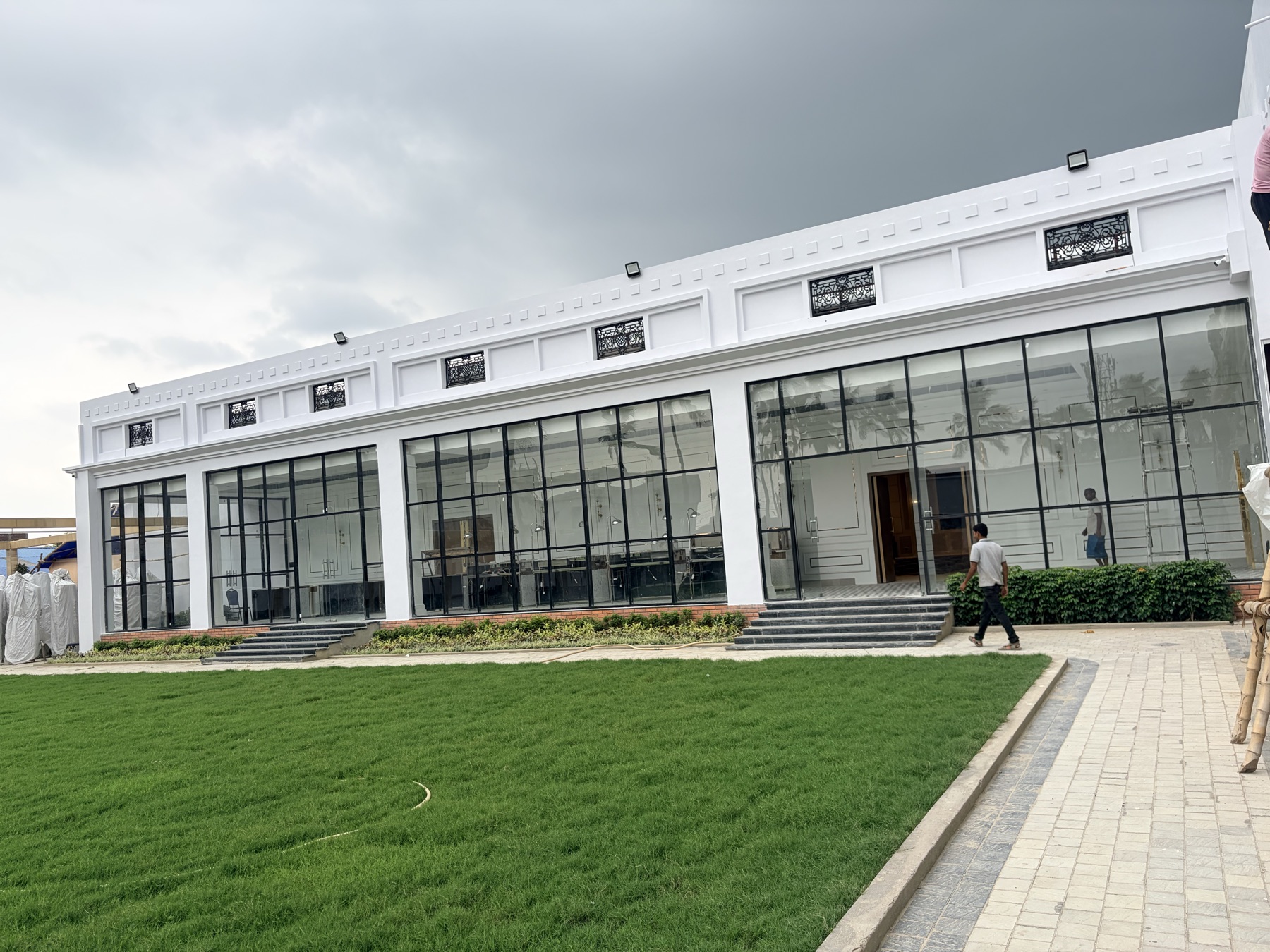 The glass-walled convention pavilion of The Chinmaye Grand
